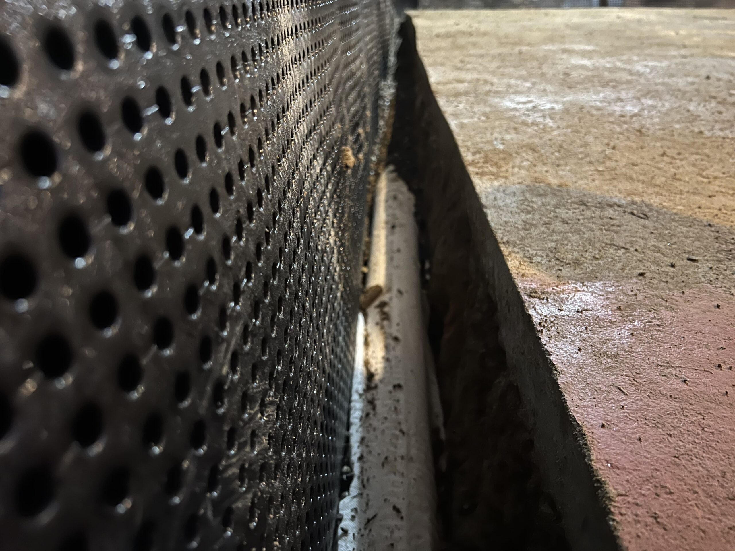 Leveled french drain pipe for a basement waterproofing project in Seattle, WA